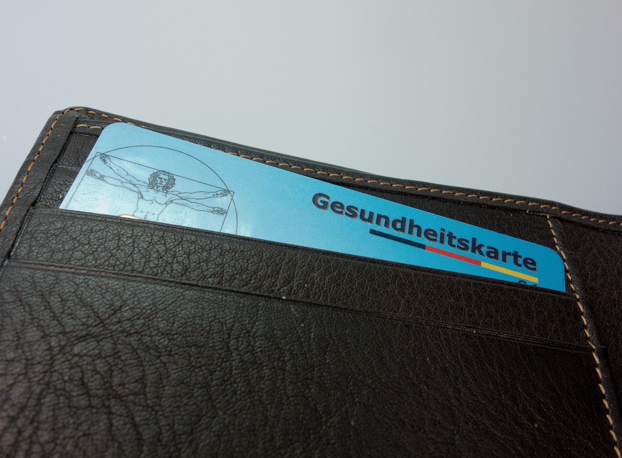 A health card in a wallet, symbolizing the importance of insurance documents, including for AxQuotes Auto Insurance.